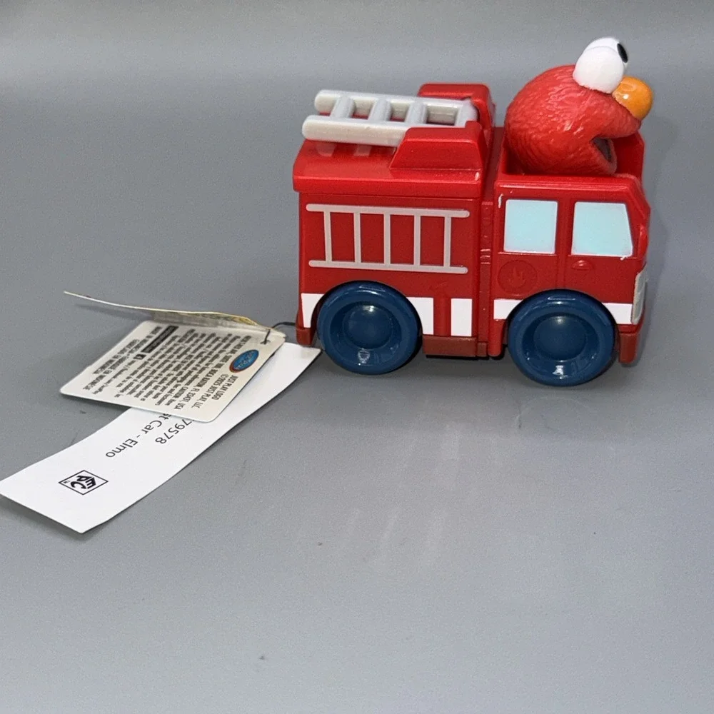 Sesame Street Twist & Pop Wheelies Elmo Fire Truck Vehicle